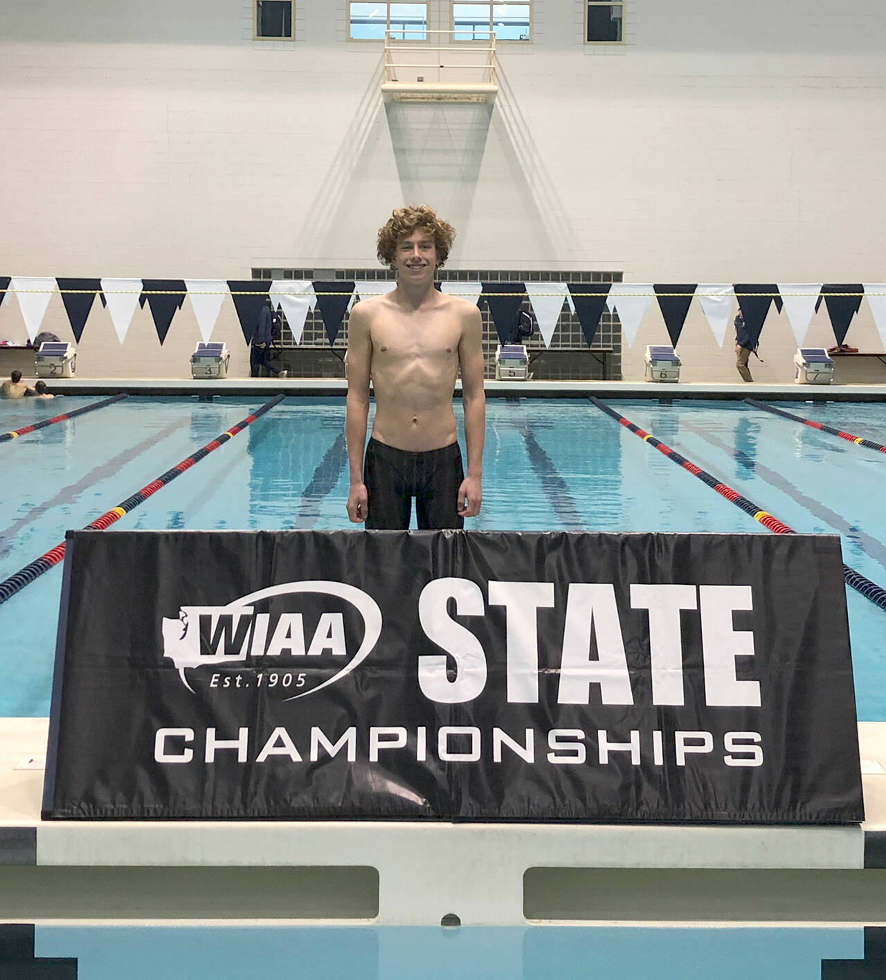 Photo courtesy of Britt Hemphill
Sequim High sophomore Colby Ellefson takes a break from the competition at the state 2A swim meet in Federal Way. Ellefson set two personal bests — in each of the 200 free and 500 free events — at the state final this past weekend.