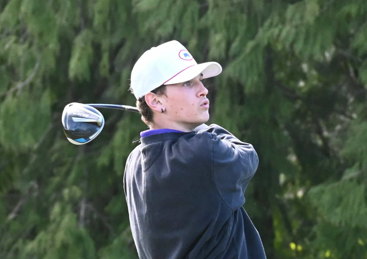 Sequim’s Dominic Riccobene watches his drive at the second hole at The Cedars at Dungeness on March 31. Riccobene shot a 39 as the Wolves topped Kingston by nine shots. Sequim Gazette photo by Michael Dashiell