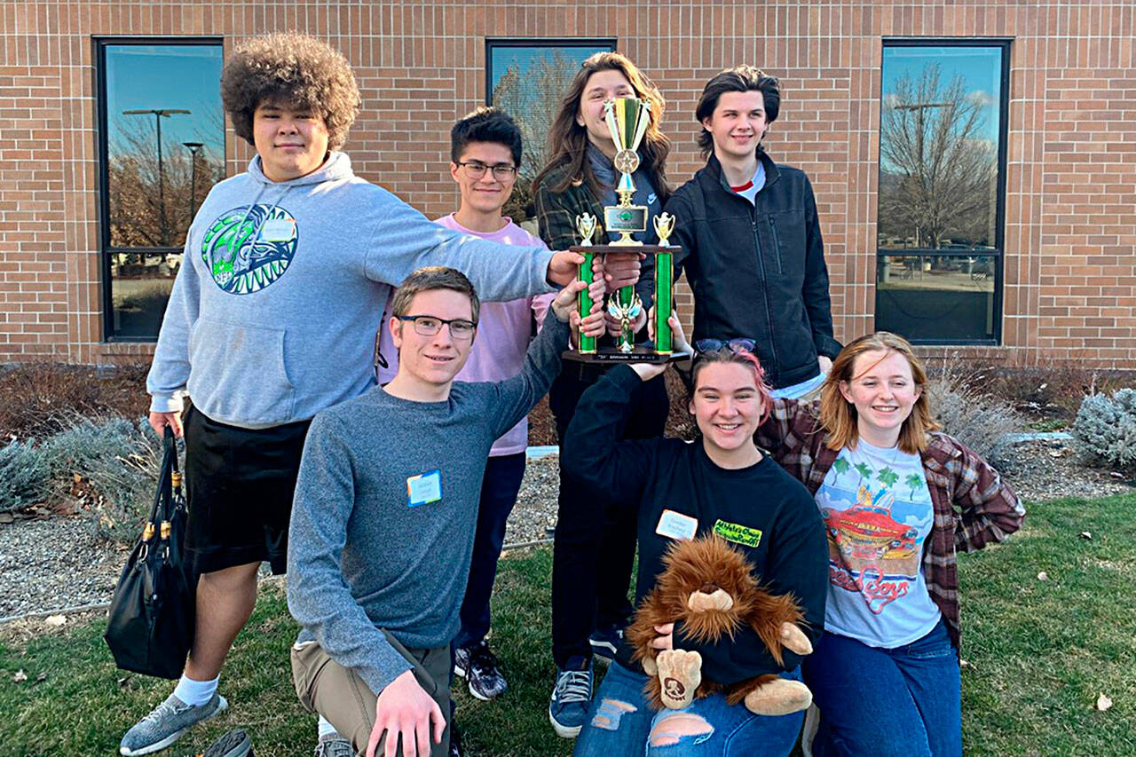 Submitted photo
Sequim High School’s Knowledge Bowl team placed third in the 2A division in March. Teammates, included, from back left, Dylan Jackson, Calem Klinger, Captain Richard Meier, Ryan Schmitt; front left, Jackson Imholt, Camber Mayfield with the team’s mascot, and Ruby Coulson, alternate.