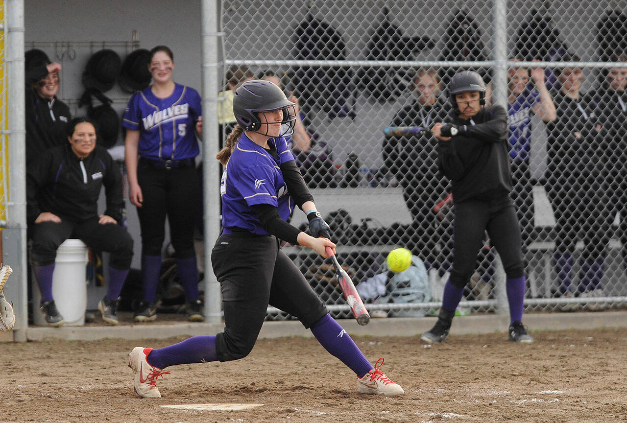 Sequim Gazette photo by Michael Dashiell
Sequim’s Christy Grubb crushes a pitch for a double in the Wolves’ 12-0 win over Forks on March 18.