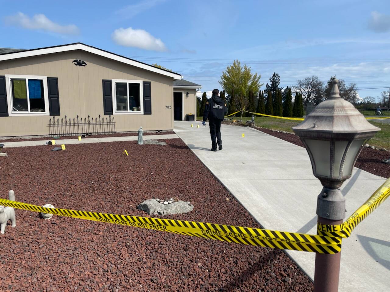 Sequim Gazette photo by Matthew Nash
Washington State Patrol’s Crime Scene Response Team survey a scene near West Hendrickson Road on April 28 where a Sequim man allegedly tried to shoot his neighbor the evening prior.