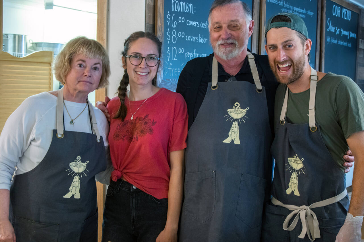 From left Katie Amundson, Anna Potter, Carl Amundson and David Rivers serve at Soup in the Alley, a ministry of Calvary Chapel in Sequim at 138 W. Washington St., open Monday through Friday 11 a.m.-2 p.m., serving chicken stock based ramen with meat, egg and vegetable toppings to all comers, regardless of financial situation. Sequim Gazette photo by Emily Matthiessen