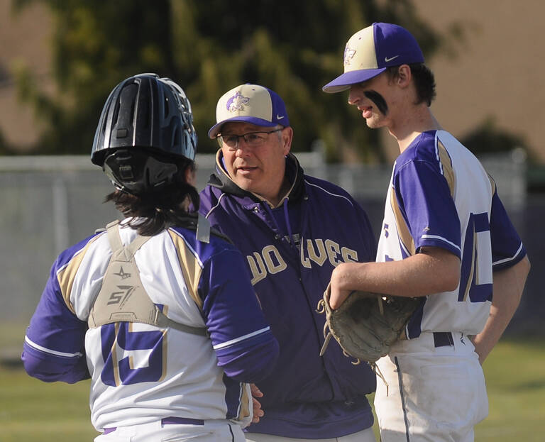 Sequim Gazette file photo by Michael Dashiell
Sequim coach Dave Ditlefsen talks with catcher Ayden Holland and pitcher Zac McCracken in the third inning of an Olympic League match-up with Bremerton on April 19.