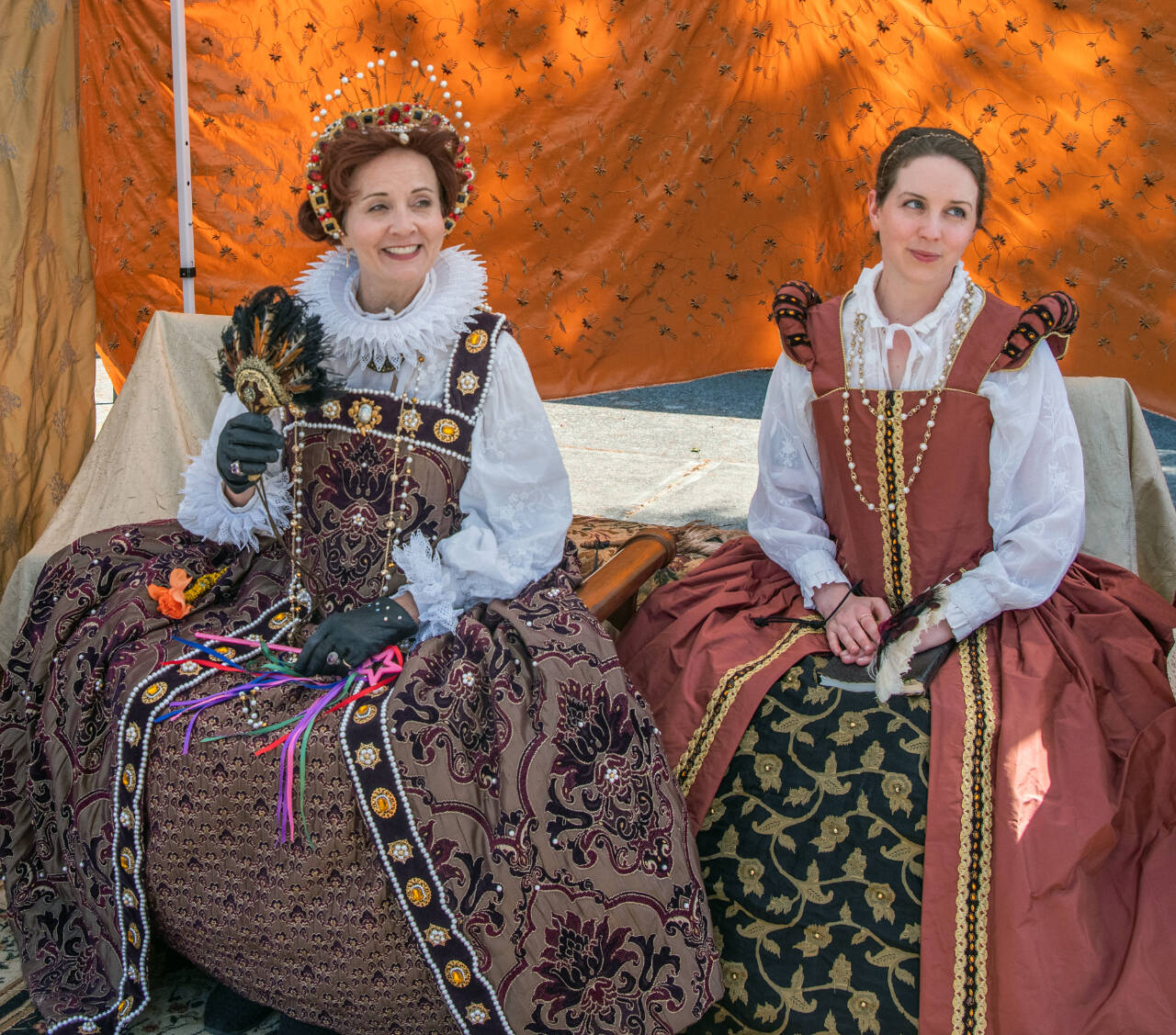 Sequim Gazette photo by Emily Matthiessen / Sarah Tucker as Queen Elizabeth I and Nicole Mischke as Lady Nicole greet visitors at Olympic Theatre Arts’ Renaissance Faire last Sunday.