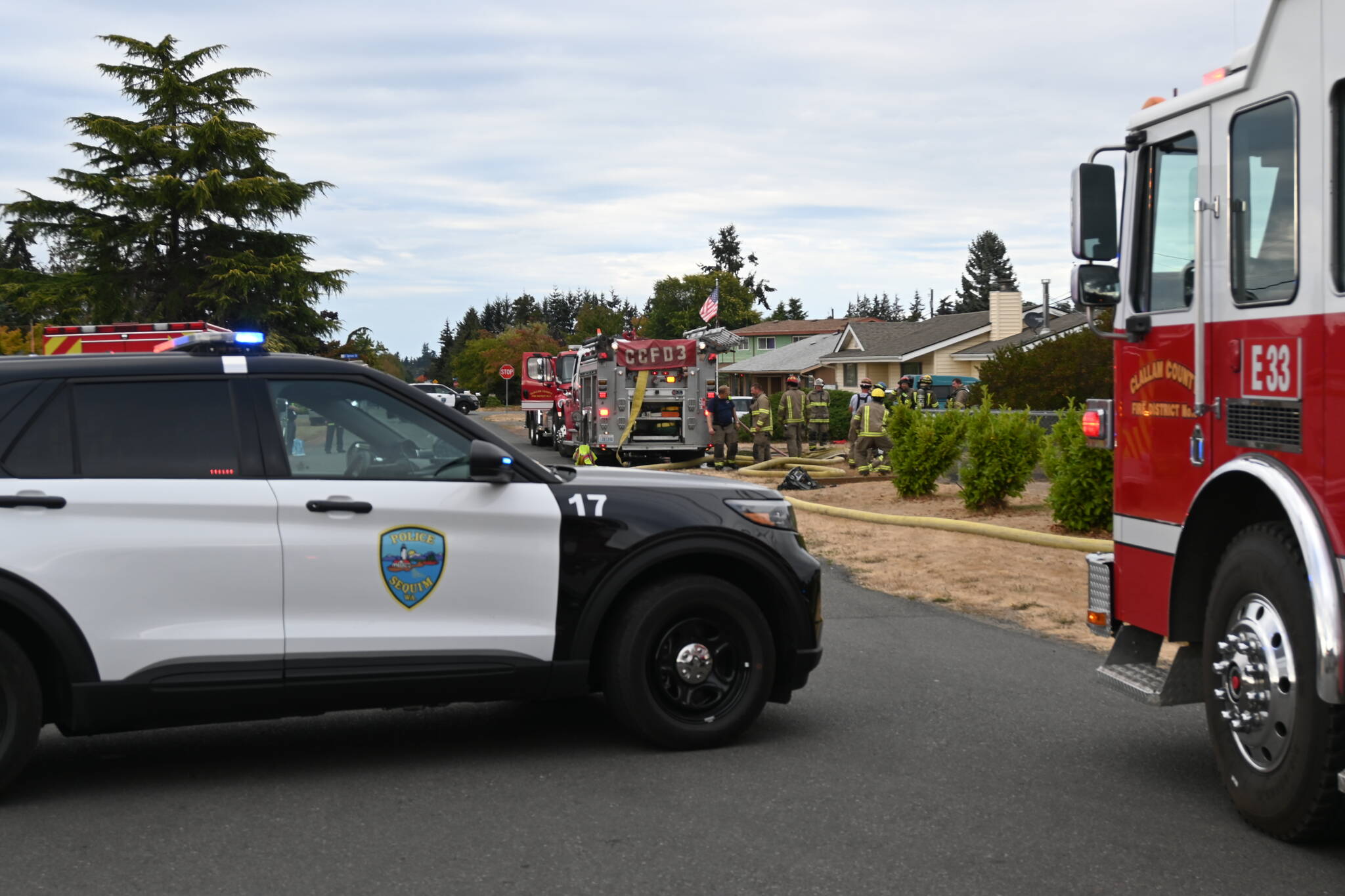 Michael Dashiell/Sequim Gazette
Firefighters from Clallam County Fire District 3 respond to a house fire on the 200 block of North Dunlap Avenue on Sept. 28.