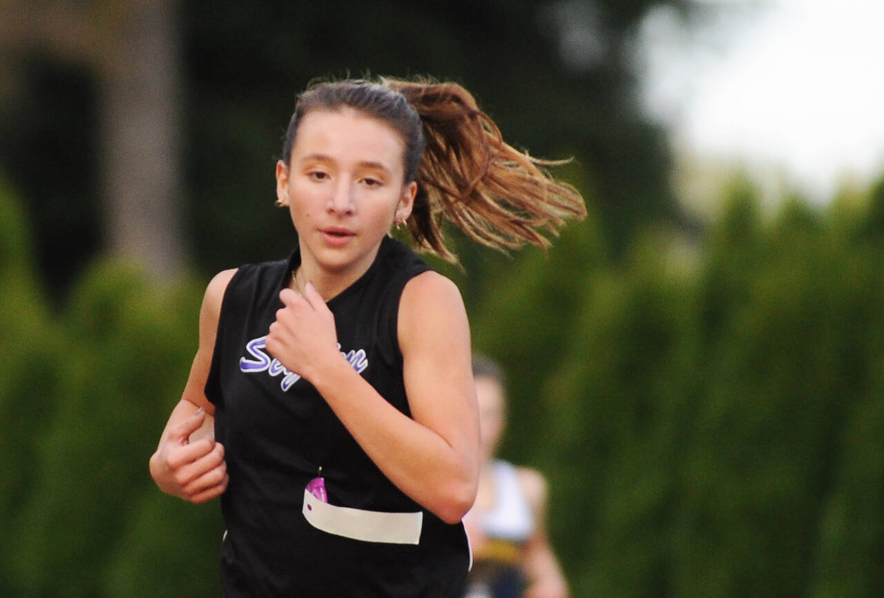 Sequim Gazette photo by Michael Dashiell / Sequim High junior Kaitlyn Bloomenrader races to a sixth place finish at the Olympic League cross country championships at The Cedars at Dungeness golf course on Oct. 20.