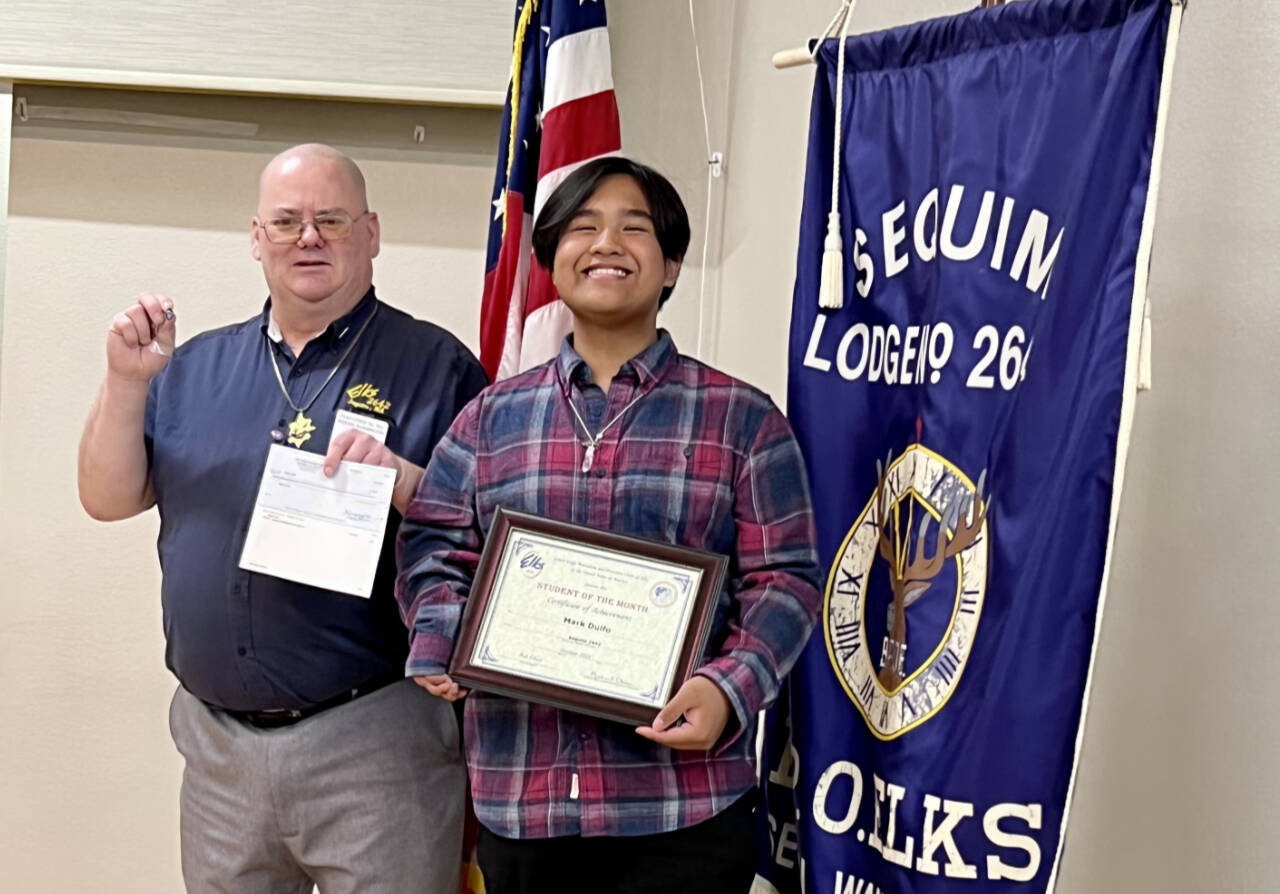 Submitted photo / Sequim High School sophomore Mark Dulfo accepts his October 2022 Student of the Month honor from Jim Headley, Elks’ Secretary and Past Exalted Ruler.