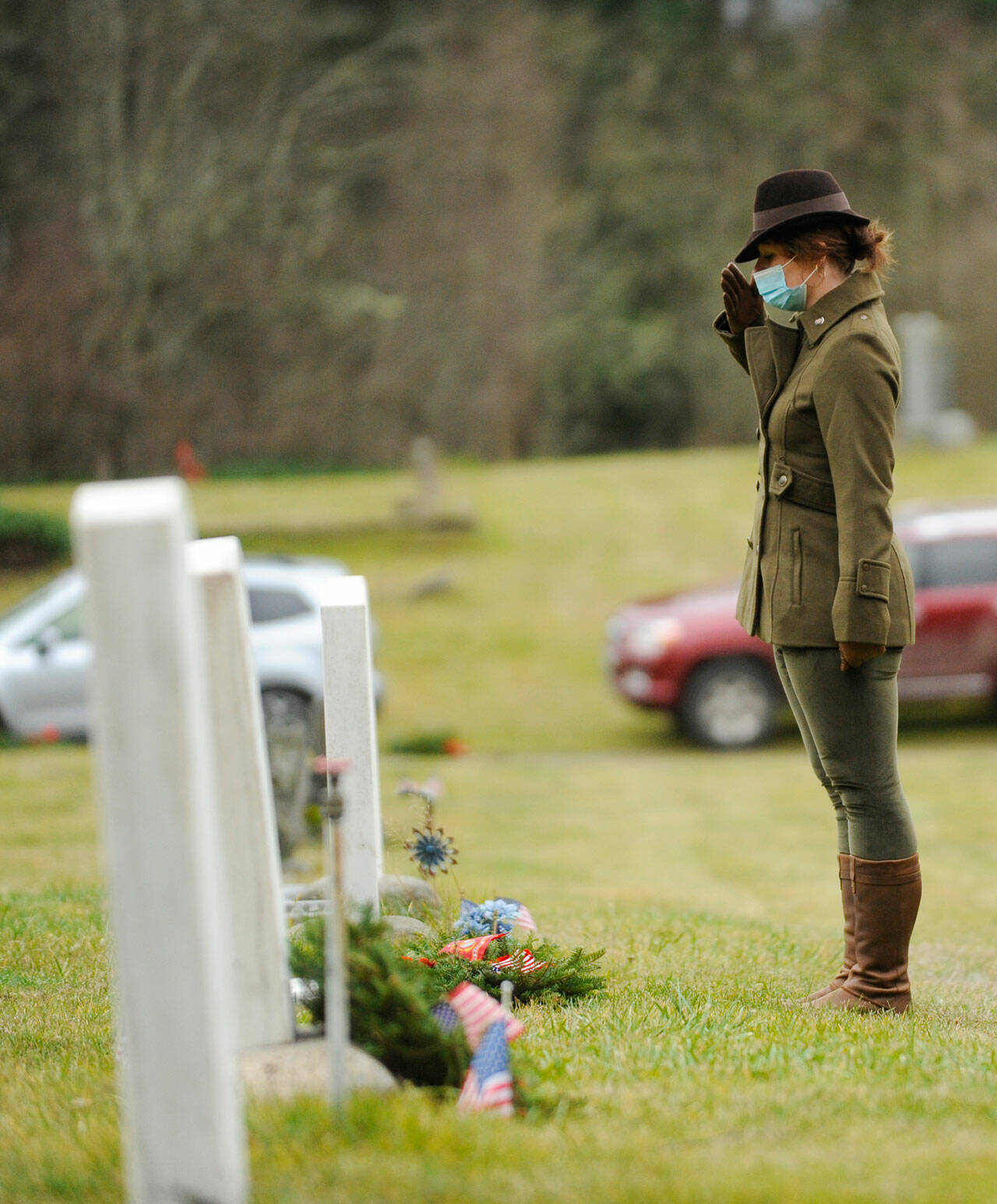 Michael Dashiell/Sequim Gazette 
Lance Cpl. Holly Rowan, a U.S. Marine Corps veteran, salutes after laying a ceremonial wreath at the Wreaths Across America event at Sequim View Cemetery in 2020.