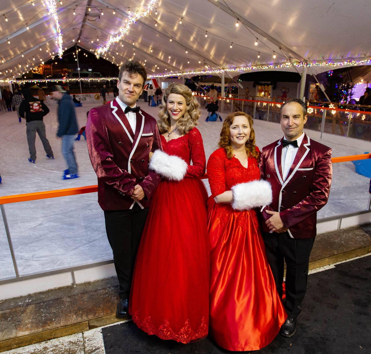 Photo by Bob Spink, courtesy of Ghostlight Productions / Noah Long (Phil Davis), Anna Pederson (Judy Haynes), Cecie McClelland (Betty Haynes) and Jeremy Pederson (Bob Wallace) pose in their costumes for “White Christmas” at the PA Winter Ice Village.