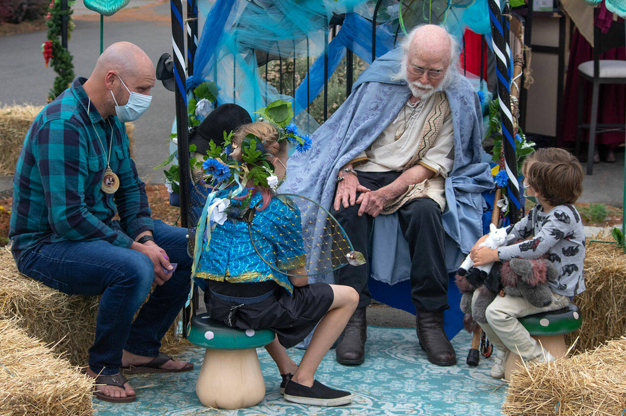 Sequim Gazette file photo by Emily Matthiessen / “James the Obscure” Hodgson, a storyteller since 1968, entertains a rapt audience in the parking lot of Olympic Theatre Arts in Sequim during their Renaissance Fair fundraiser in 2021.