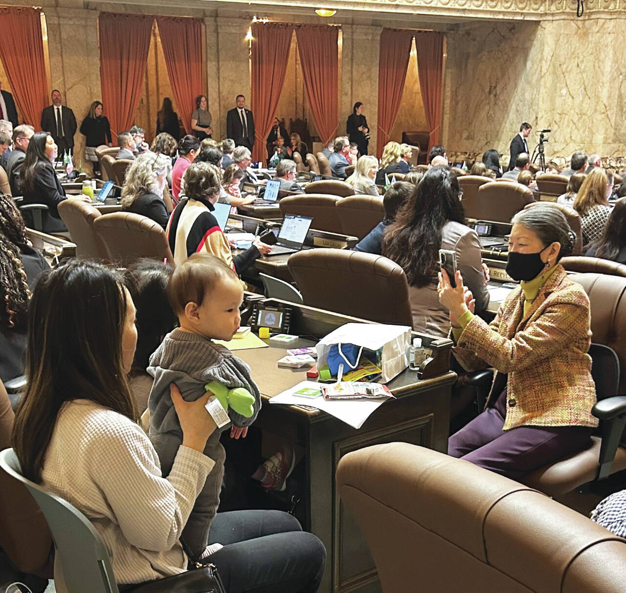 Photo courtesy of WNPA News Service / Children’s Day in the state Legislature last week fills the House chamber with children and grandchildren to witness passage of legislation naming a state dinosaur.