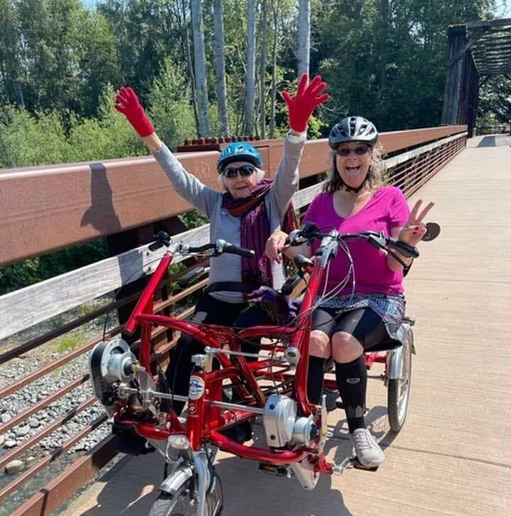 Photo courtesy of Sequim Wheelers / Rita McCabe, left and Lanie Cates enjoy a ride on the Olympic Discovery Trail.