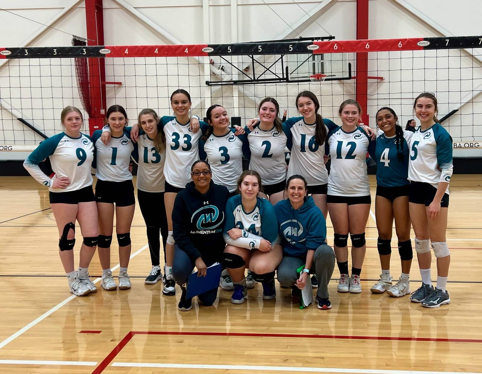 Submitted photo / Member of Momentum One’s 18U Tsunami team celebrate a strong finish in the President’s Day Tournament in Seattle in mid-February. Pictured are (back row, from left) Keana Rowley (Forks), Erica Williams (Forks), Paige Pangaro (Port Angeles), Arianna Stovall (Sequim), Port Angeles’ Josephine Edgington, Jasmine Messinger, Ava Hairell, and Lily Halberg, Eladia Hernandez (Forks) and Maryrose Halberg (Port Angeles), with (front row, from left) coach Lucritia Stansbury-Hernandez (Forks), Sydney Hegtvedt (Sequim) and coach Christine Grunch-Halberg (Port Angeles). Not pictured is coach Kix McArthur (Sequim).