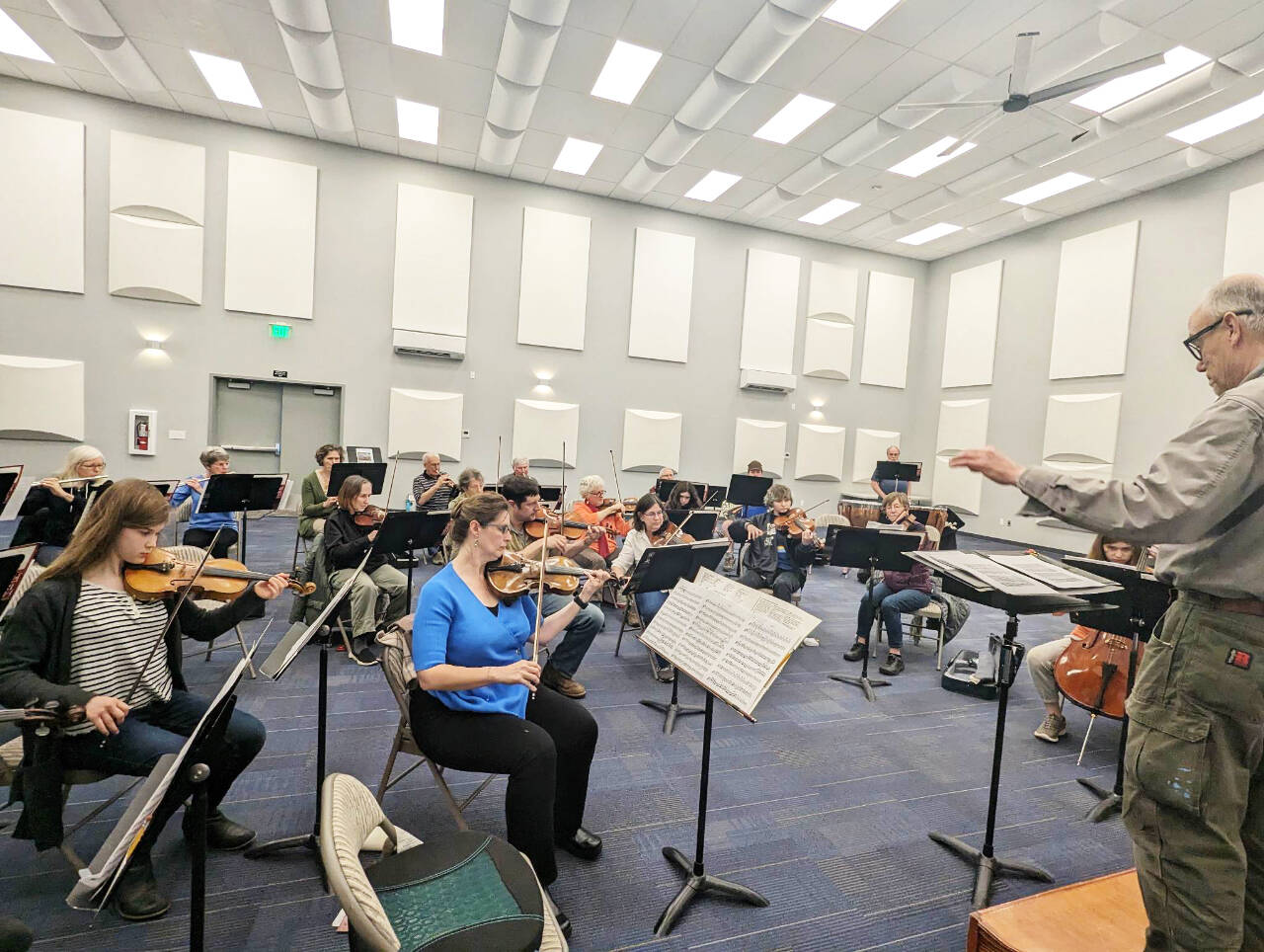 Photo courtesy of Sequim Community Orchestra / Conductor/music director Phil Morgan-Ellis leads a Sequim Community Orchestra rehearsal on April 25 at the Sequim City Band’ expanded rehearsal hall at the James Center for Performing Arts. The orchestra closes their 11th season with a free concert and bake sale at 7 p.m. on Saturday, May 13, at Trinity United Methodist Church.