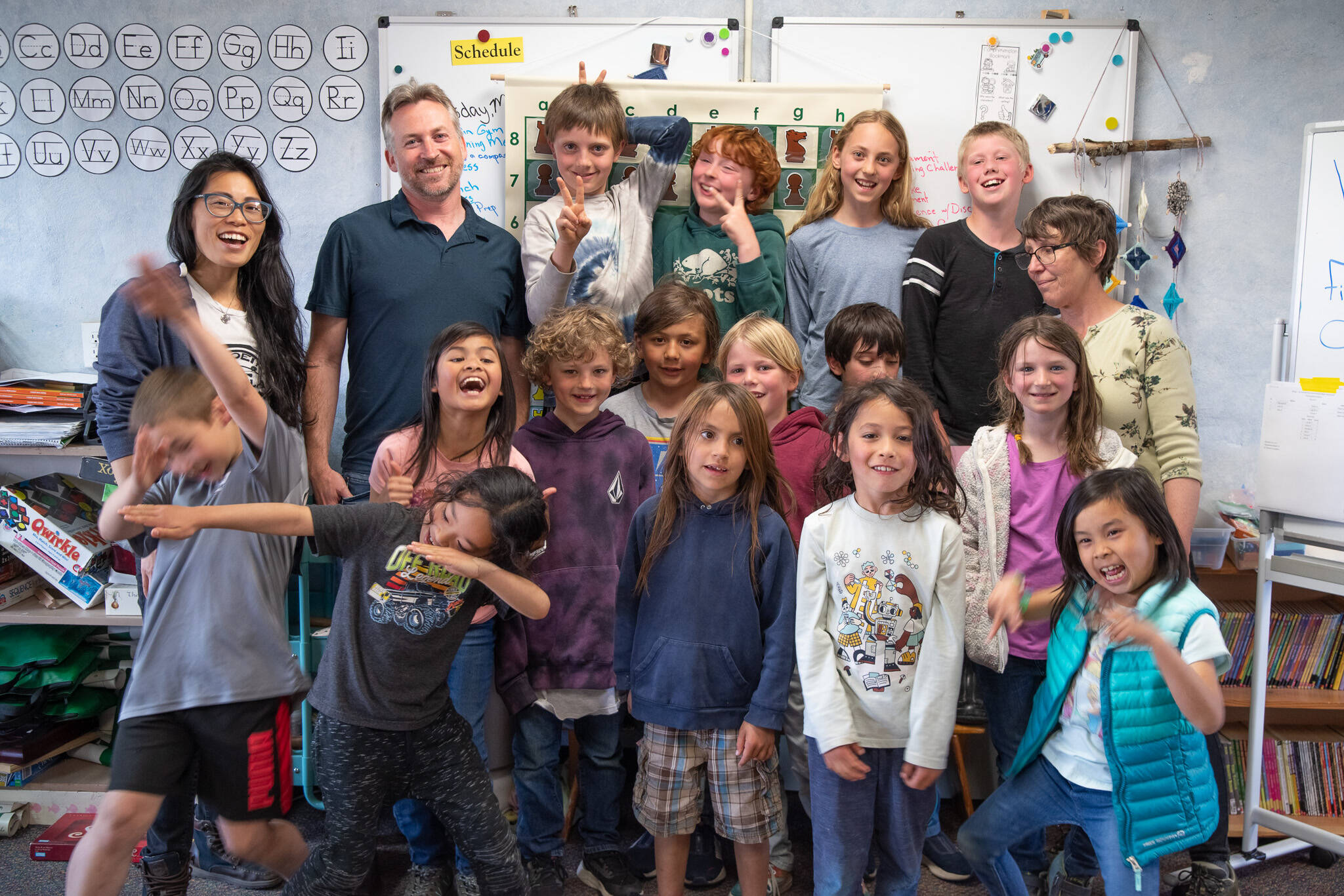 Sequim Gazette photoS by Emily Matthiessen
Members of Five Acre School’s chess club celebrate after the end-of-the year tournament, a culmination of months of learning to think like a chess player, on May 31. Pictured are (back row, from left) teacher Derek Silfe, Spencer Armstrong, Miles Taylor, Hoko Saari and Thomas Bagley, (middle row, from left) organizer Theresa Churchill, Emma Tran, Ailo Saari, Soren Albright, Nevada Batcheller, Alex Amirsadeghi and Salan Petersen and Adventure teacher Dianne Sullivan, and (front row, from left) Hunter Moss, Kazuki Feinstein, Arie Barrett, Lucian Churchill and Mya Tran.