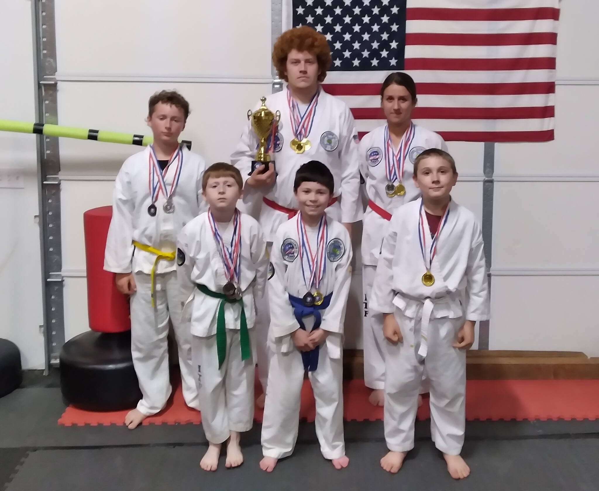 Photo courtesy of Larry Muckley
Next Level Taekwondo athletes celebrate strong finishes at a tournament in Battle Ground in May. Pictured are (back row, from left) Wyatt Estep, Jobe Kirner and Mia Kirner, with Maverick Muckley, Gunner Muckley and Atticus Reed.