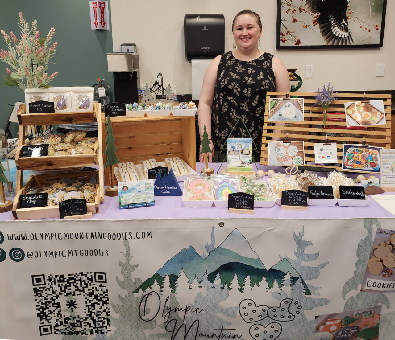 Photo courtesy of Vicki Swann/ Laira Stewart, seen here participating in an art show at the Dungeness Nature Center in June, is one of the artists with Rainshadow Artisans. Stewart creates custom sugar cookies.