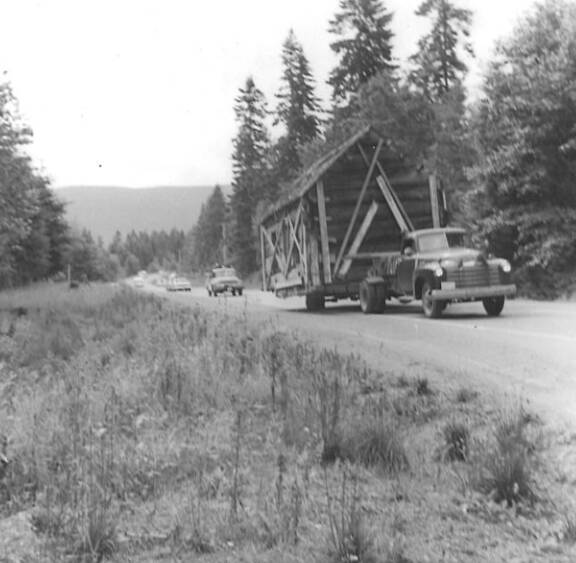 Photo courtesy of the Sequim Prairie Garden Club
The pioneer log cabin now at Pioneer Memorial Park is transported from Chicken Coop Road on July 19, 1966.