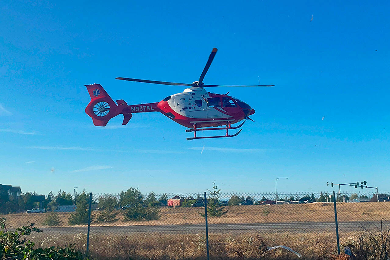 Sequim Gazette photo by Matthew Nash/ A 26-year-old man was airlifted on July 17 after his truck rolled over on the River Road off-ramp. He was listed as in serious but stable condition, according to Battalion Chief Elliott Jones with Clallam County Fire District 3.