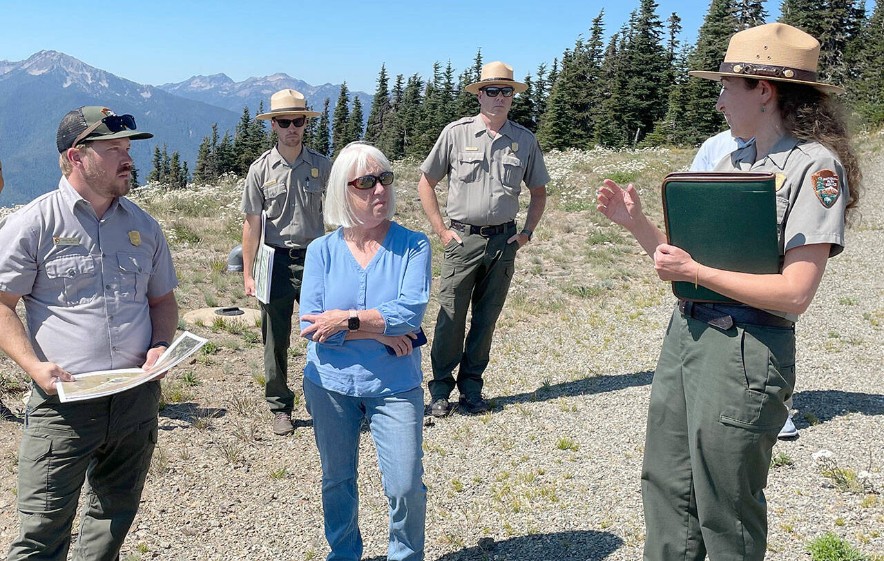 Photo by Paula Hunt/Olympic Peninsula News Group / On a trip to the Olympic National Park last week, Sen. Patty Murray, center, listens to Olympic National Park Superintendent Sula Jacobs, right, explain the ongoing investigation into the cause of the fire that destroyed the Hurricane Ridge Day Lodge on May 7, and the park’s efforts to maintain visitor access this summer and possibly into the winter.