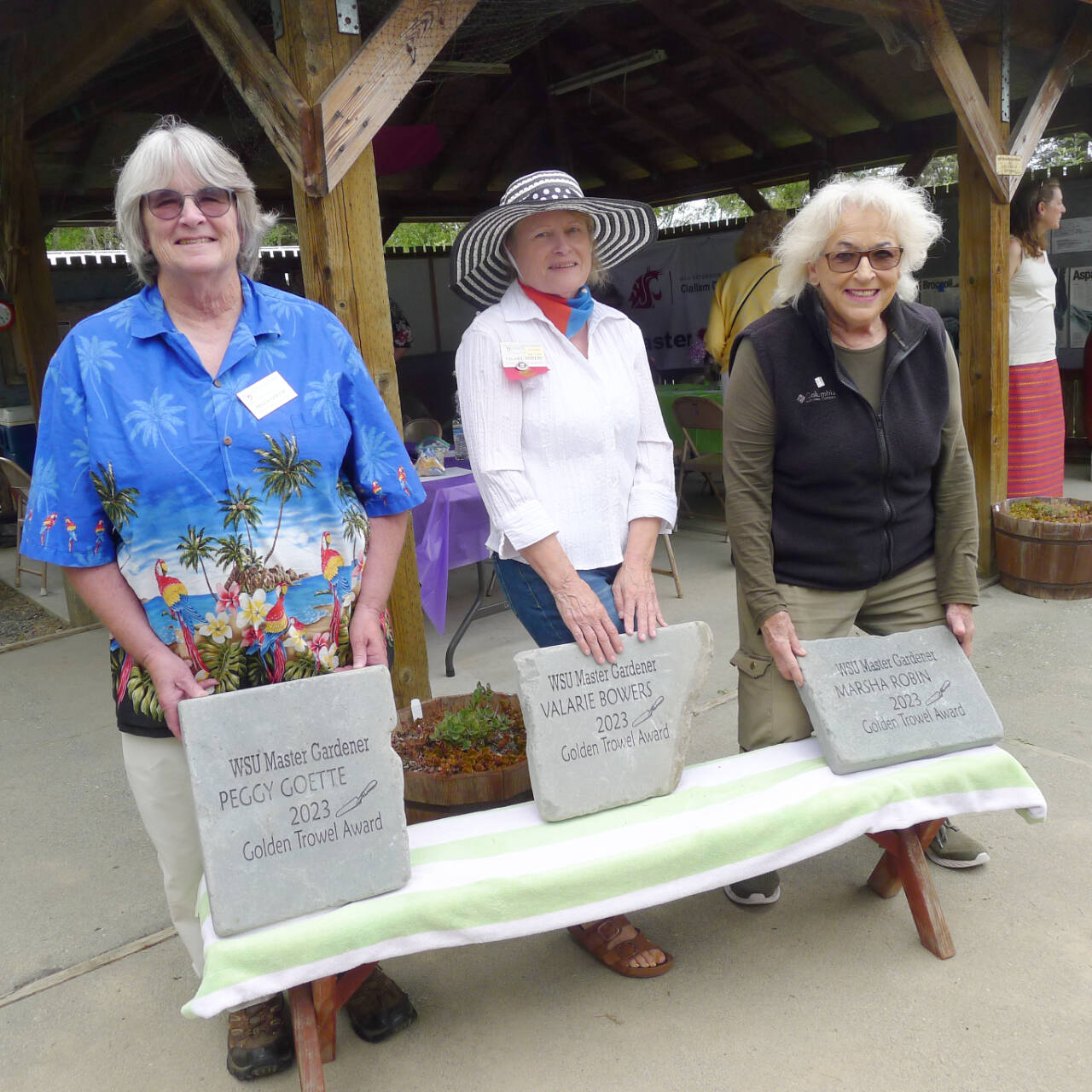 Photo courtesy of Clallam County Master Gardeners / From left, Clallam County Master Gardeners Peggy Goette, Valarie Bowers and Marsha Robin accept their Golden Trowel Awards they earned for longevity of service and accumulating more than 750 hours of volunteer time.