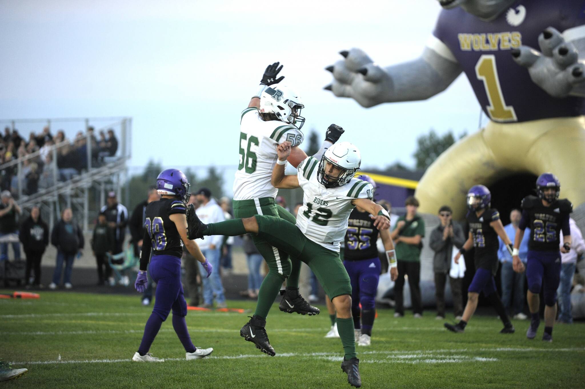 Sequim Gazette photo by Michael Dashiell / Port Angeles’ Kason Albough, right and Tanner Flores celebrate Albough’s first quarter touchdown in the Roughriders’ 37-10 win in Sequim on Sept. 22.