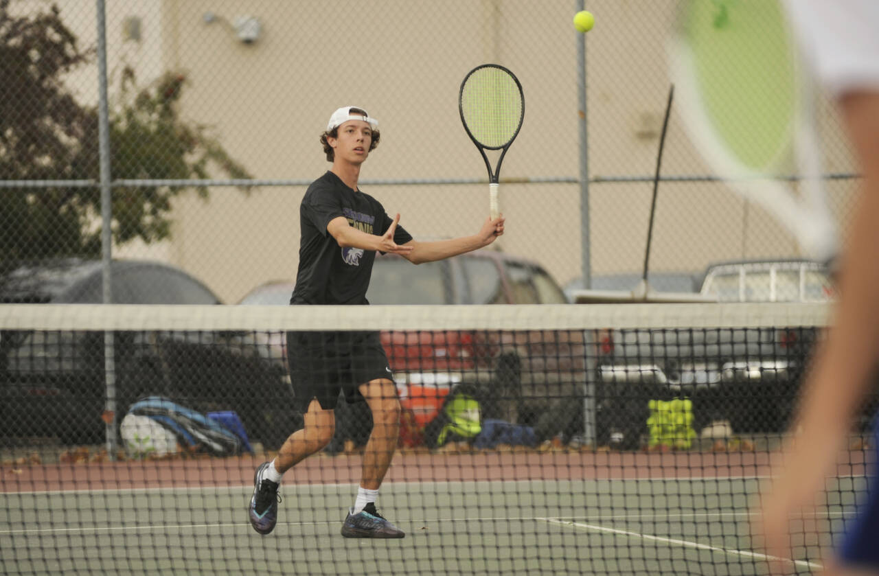 Sequim Gazette photo by Michael Dashiell / Sequim’s Garrett Little sizes up a forehand as he takes on Olympic’s Ryan Flatley on Sept. 19. Little won the match in two sets to stay undefeated on the season.