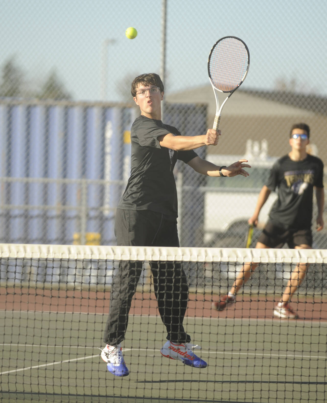 Sequim Gazette photo by Michael Dashiell / Sequim’s William Hughes, left, and Tom Laschet take on a Kingston team in No. 1 doubles play on Oct. 5 in Sequim.