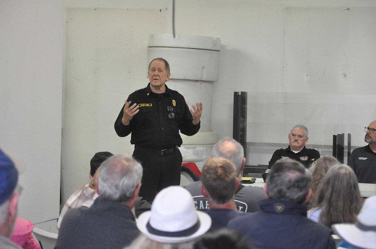 Sequim Gazette photo by Matthew Nash
Interim Fire Chief Dan Orr speaks to a crowd of 30-plus people at Clallam County Fire District 3’s Lost Mountain Station on Oct. 9. Fire commissioners are considering selling the site to help offset costs for a new Carlsborg station.