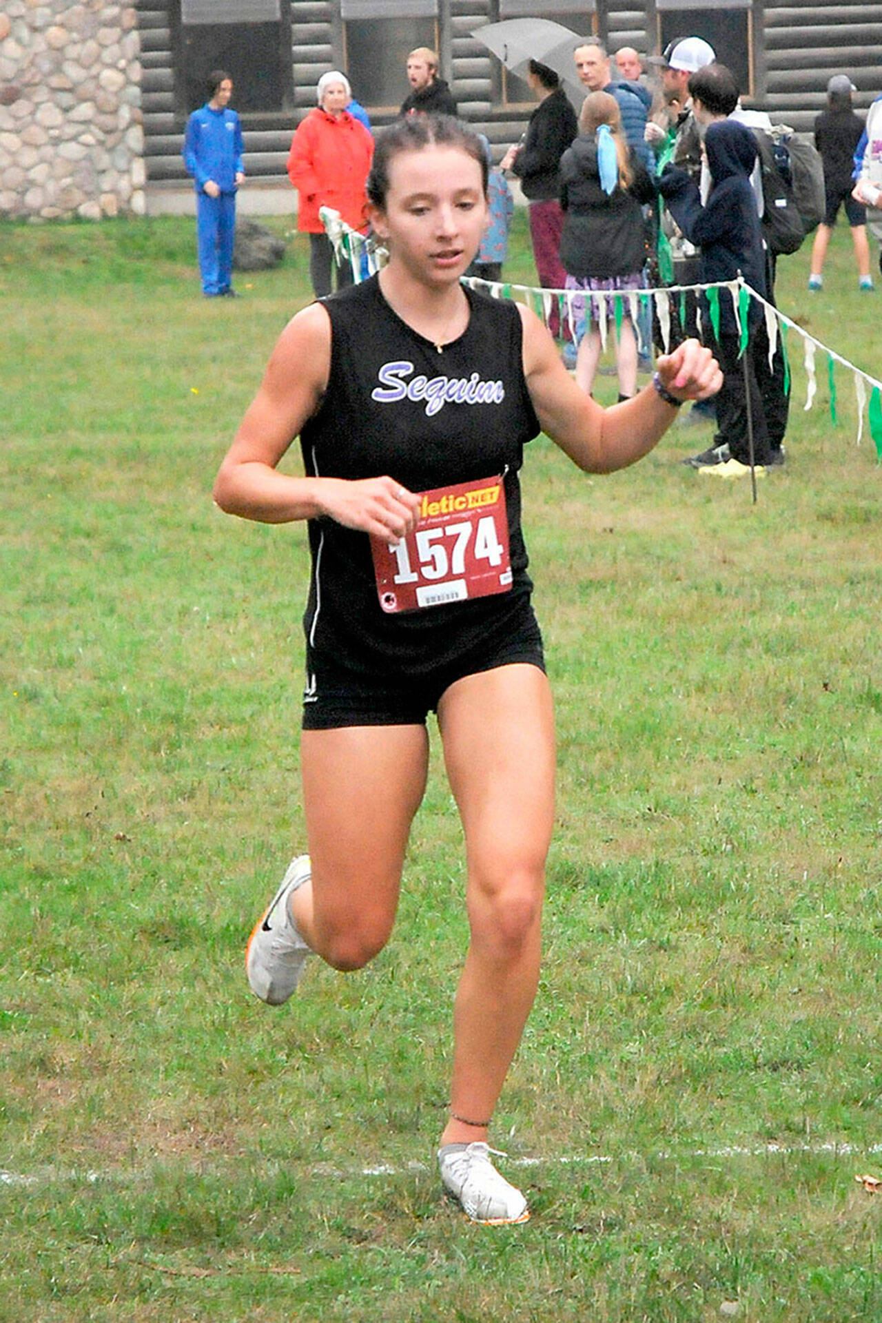 Photo by Keith Thorpe, Olympic Peninsula News Group/
Sequim’s Kaitlyn Bloomenrader crosses the finish line to take second in the Olympic League Championships at Lincoln Park in Port Angeles on Oct. 19.