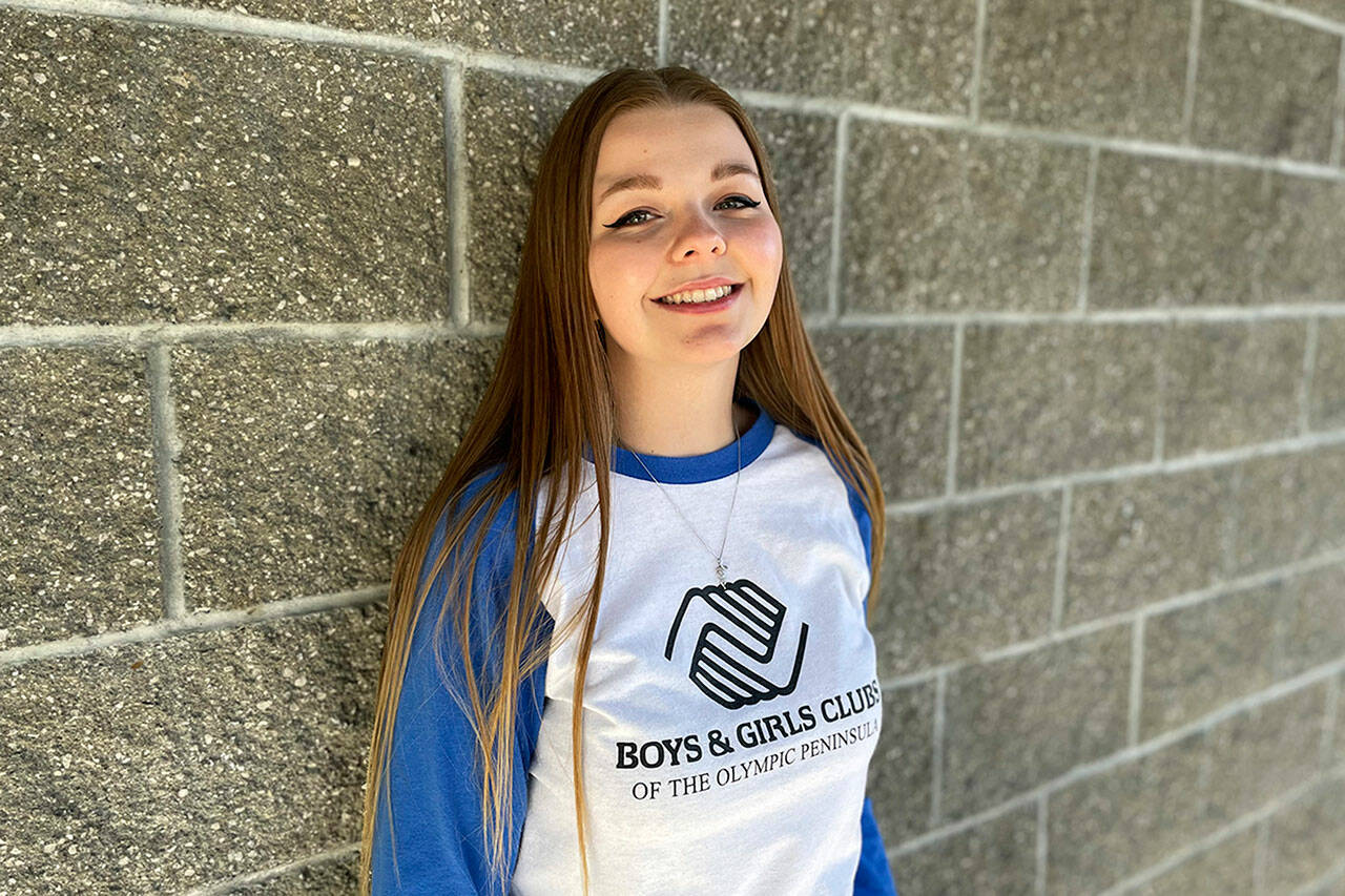 Sequim Gazette photo by Matthew Nash/ Pearle Peterson, 18, stands outside Sequim’s Carroll C. Kendall Unit of the Boys & Girls Club where she’s attended for 11 years. She’ll represent the local club and national organization on Oct. 28 at the World Series where she’ll sing the National Anthem.