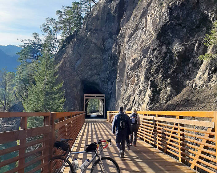 Sequim Gazette file photo by Michael Dashiell / Bicyclists and hikers approach the Daley Rankin Tunnel on a sunny day at the Spruce Railroad Trail in 2020. Rock slides last week have closed the popular trail near the Daley Rankin Tunnel, park officials said.