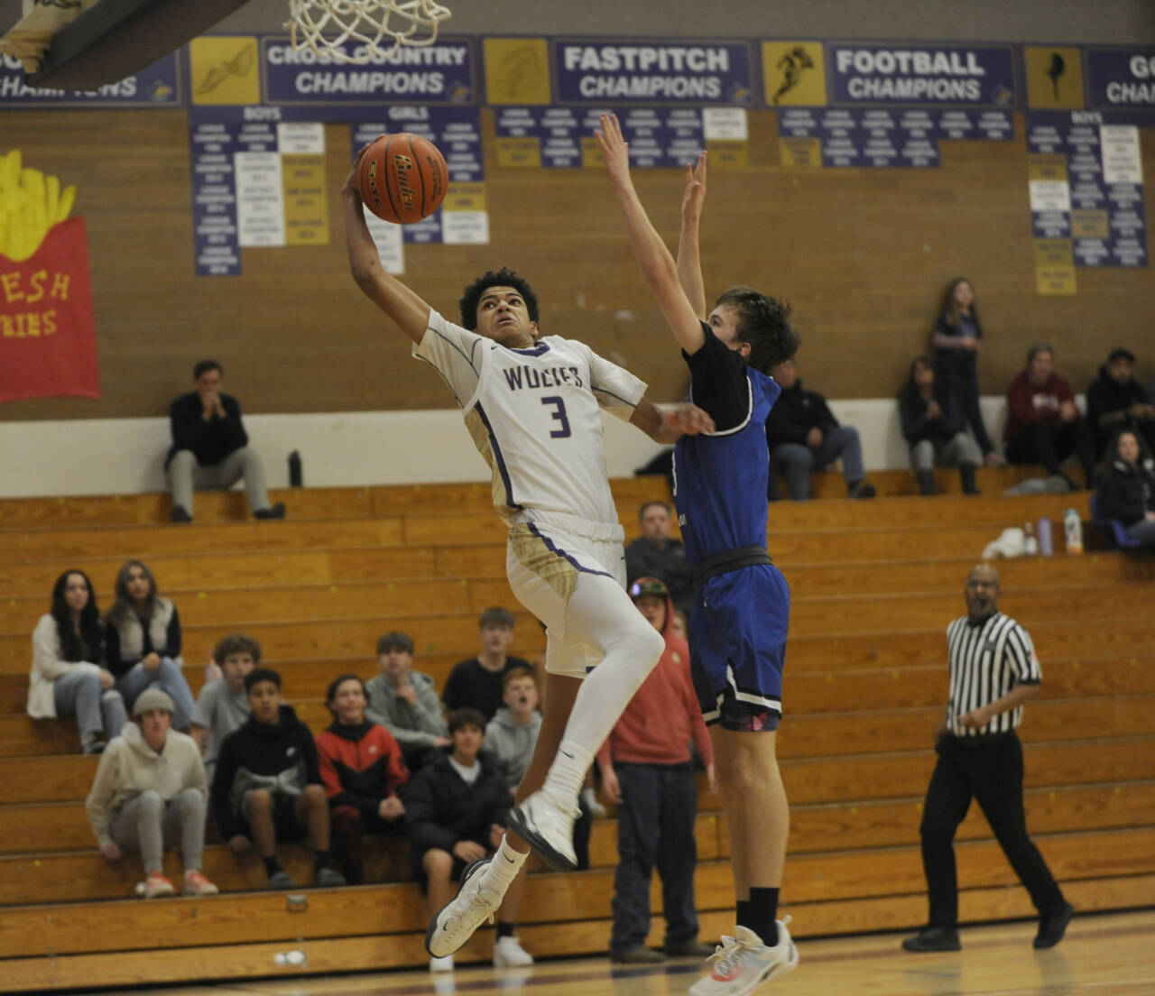 Sequim Gazette photos by Michael Dashiell
Sequim’s Solomon Sheppard, left, drives to the basket in the first half of the Wolves’ 70-56 home win over North Mason on Jan. 2. Defending the play is North Mason’s Cameron Revelez.