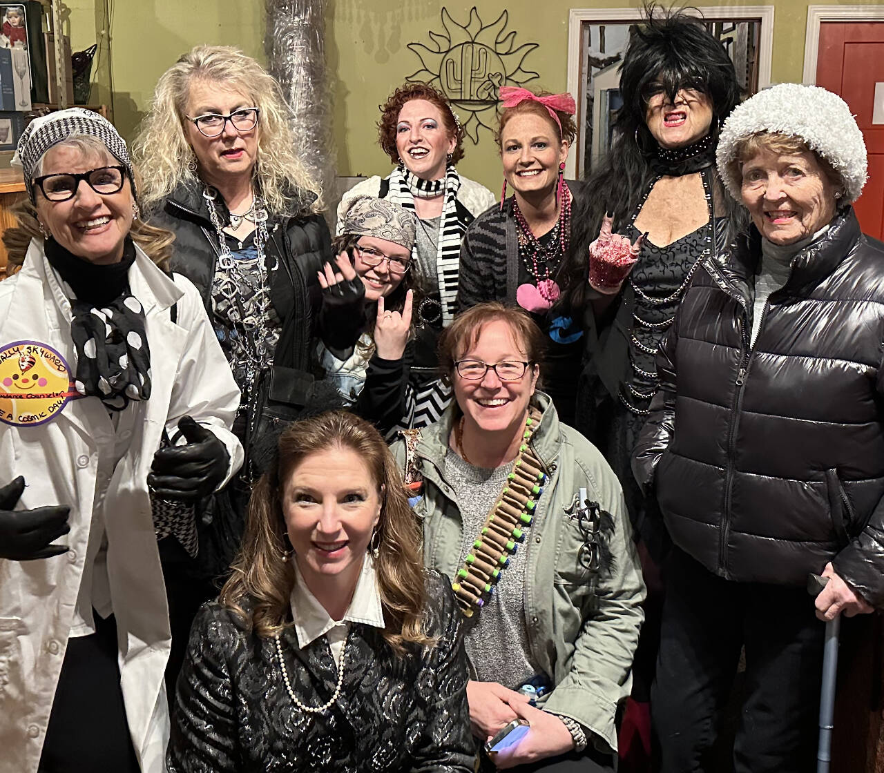 Photo courtesy of Renne Emiko Brock / Suspects in the First Friday Art Walk Sequim’s eighth-annual “Whodunnit Downtown?” Mystery Game include Kelly Phillips, Susan Baritelle, Ericka Albers, Sheri Whetstine, Julie Hembre, Susan Cates, Caitlin Knapple, Emily Westcott and CaptainCrystal Stout.