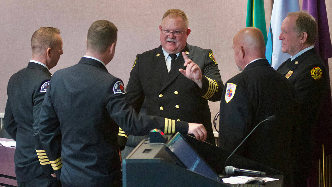 Photo courtesy Jay Cline/CLallam County Fire District 2
Deputy chief Justin Grider with Clallam County Fire District 2, center, has accepted an offer to become Clallam County Fire District 3’s next fire chief. Here he speaks with local fire district leaders — from let, Derrell Sharp, Port Angeles Fire District chief; Joel McKeen, Port Angeles Fire District assistant chief; Greg Waters, Joyce Fire and Rescue chief Greg Waters, and Dan Orr, Fire District 3 interim fire chief — at a recruit graduation in 2023.