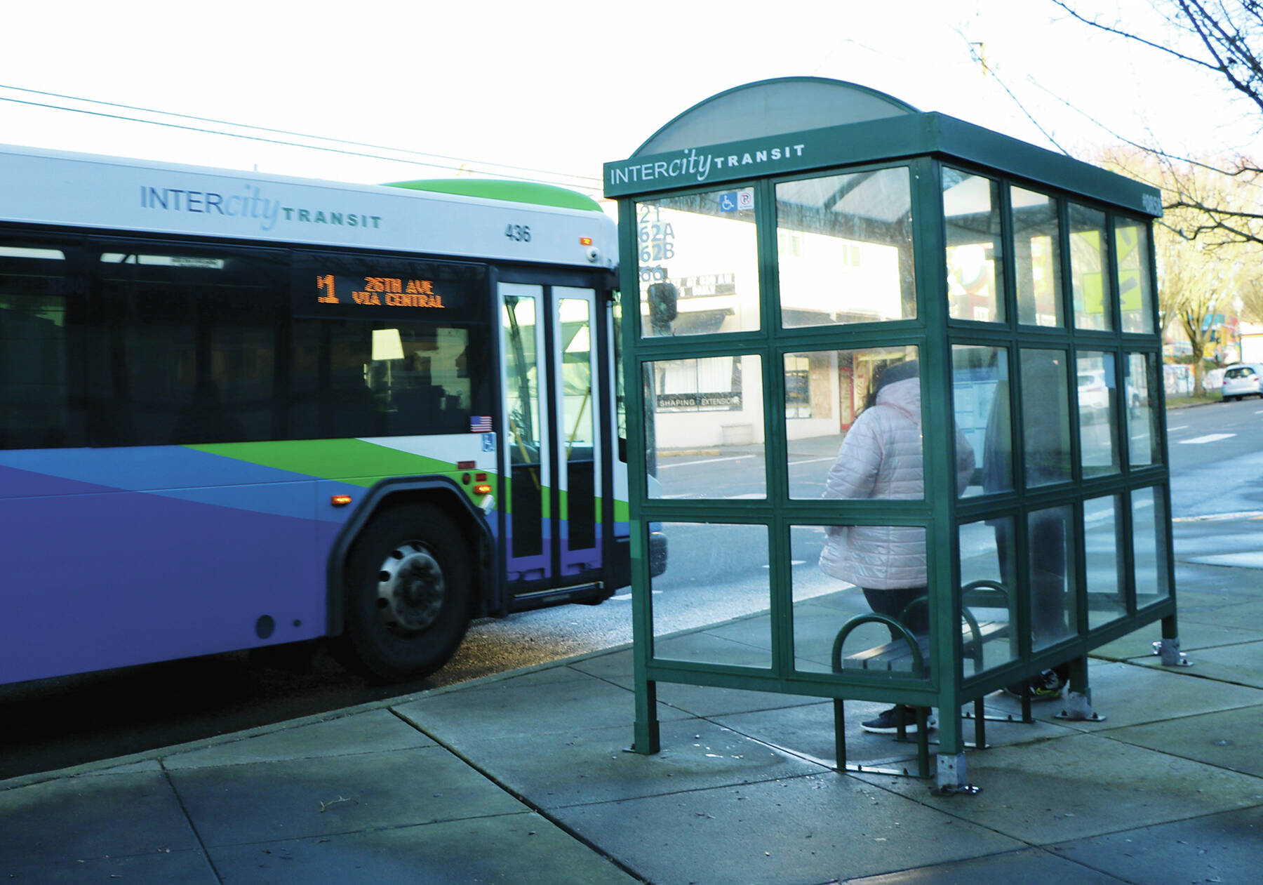 Photo by Mary Murphy/Washington State Journal Pedestrians wait to board an Intercity transit bus in downtown Olympia. Affordable homes near transit hubs are needed, state officials say, but regulations might cause developers to back away, critics say.