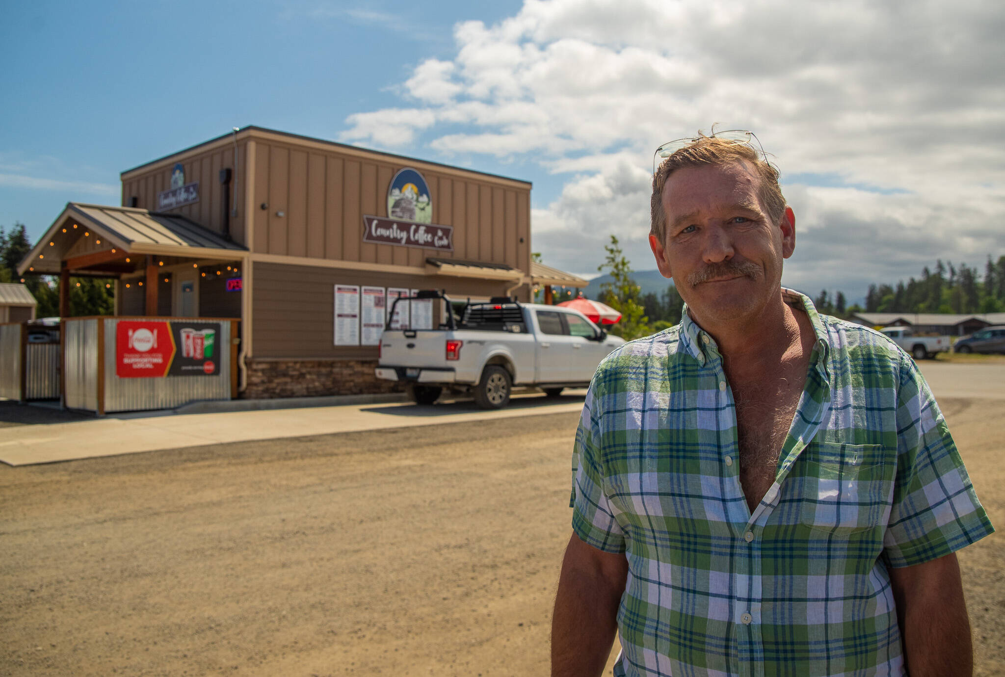 Sequim Gazette file photo by Emily Matthiessen / Tracy Bloom, pictured here speaking about his new business Country Coffee and Grub from the parking lot of “Bloom Town” in Carlsborg, unexpectedly died at his Sequim home on Jan. 22.