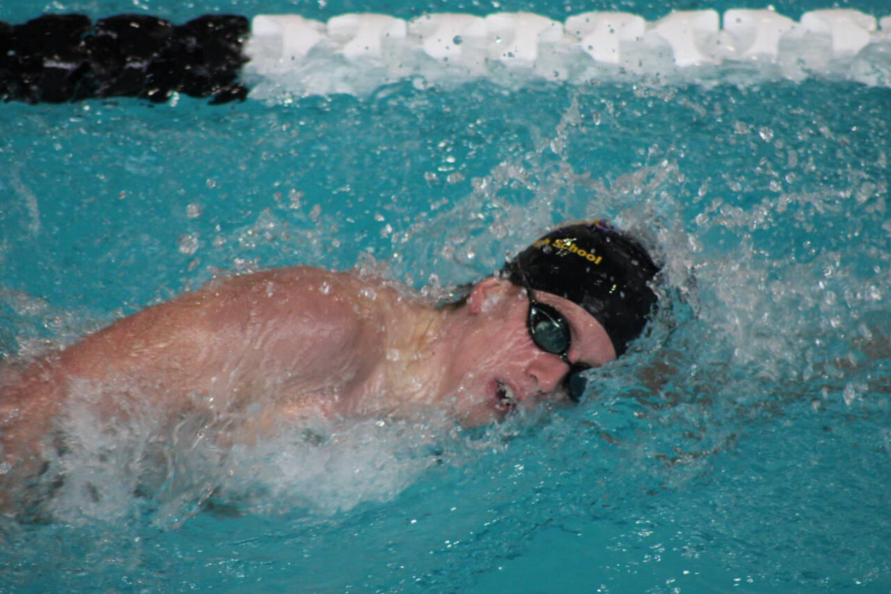 Photo by Eric Ellefson / Sequim's Colby Ellefson races to two top-two finishes at the West Central District meet last week, earning his third trip to the 1A/2A state swimming finals.