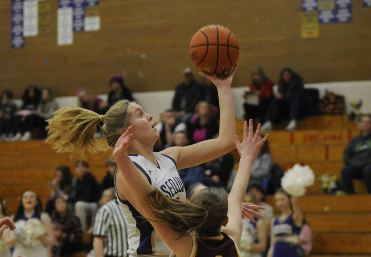 Sequim Gazette photos by Michael Dashiell
Sequim’s Jolene Vaara drives to the basket for two of her eight points in the Wolves’ 66-49 loss to Enumclaw on Feb. 14, in Sequim’s bi-district tourney opener.