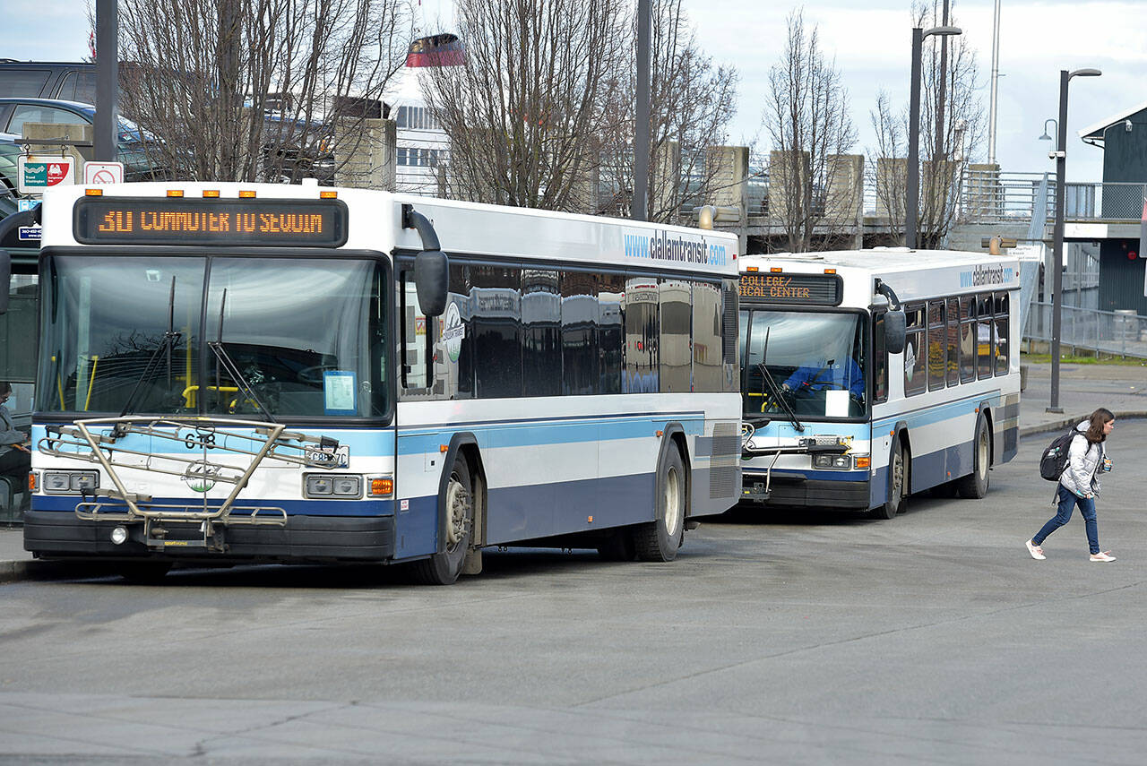 Photo by Keith Thorpe/Olympic Peninsula News Group
A pair of Clallam Transit buses sit at The Gateway Transit Center in Port Angeles in preparation for their fixed-route runs on Feb. 22.