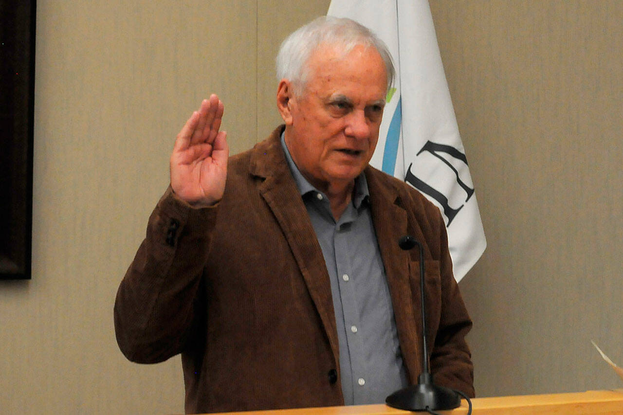 Sequim Gazette file photo by Matthew Nash
Tom Ferrell takes his oath office for Sequim city council seat on Jan. 8 in the council chambers. He announced plans to resign by March 31. City of Sequim staff plan to open applications starting March 11 for two weeks.