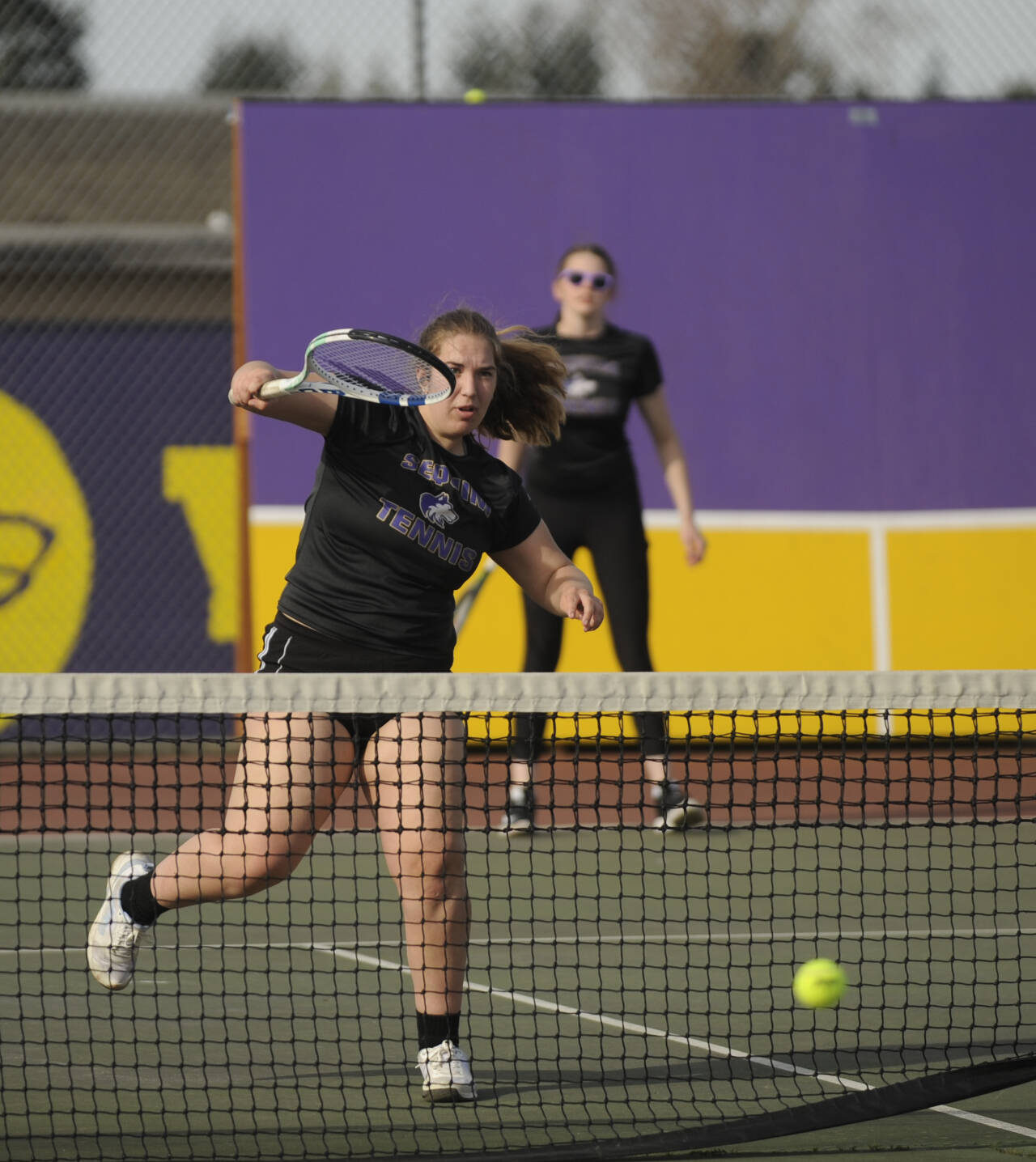 Sequim Gazette file photo by Michael Dashiell
Sequim’s Sydney Hegtvedt, left, puts away a point as she and teammate Dani Herman take on a Port Angeles doubles team in 2023. Hegtvedt and Herman are the two returning seniors on the 2024 Sequim squad.