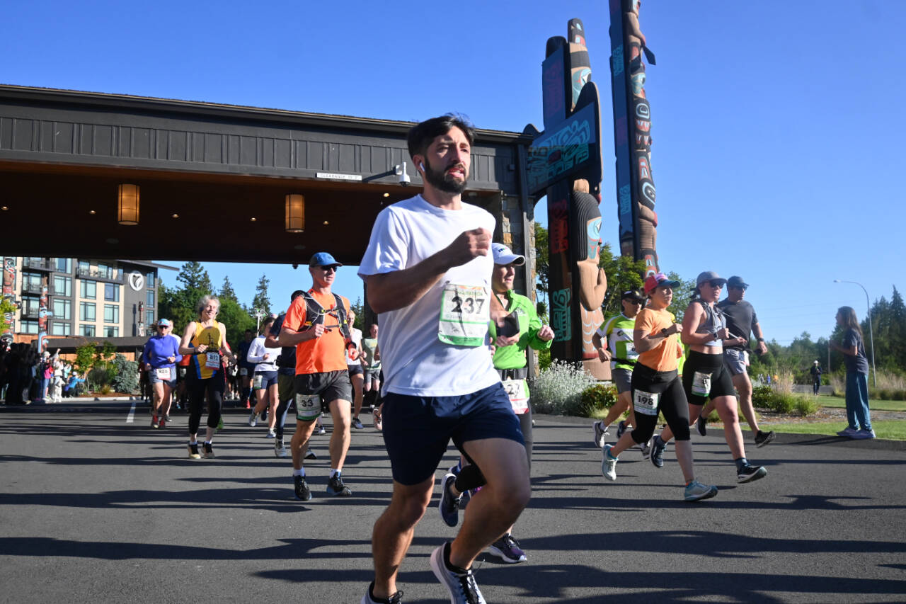 Sequim Gazette file photo by Michel Dashiell / Runners break from the starting line of the North Olympic Discovery Marathon in June 2023. This year's event is slated for June 2.