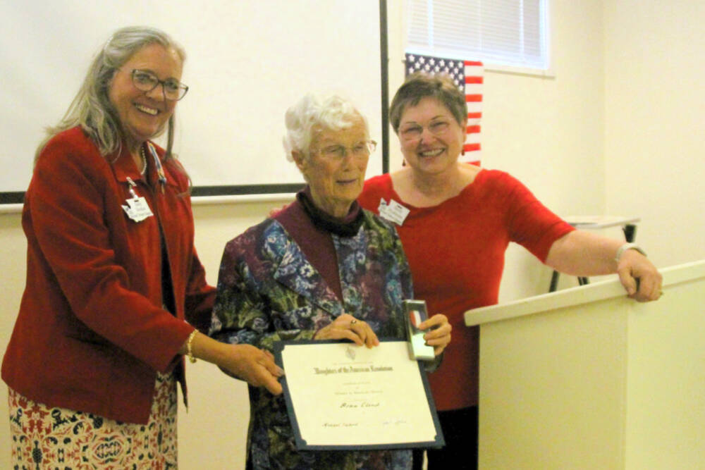 Photo courtesy of Sandy Frykholm / Dona Cloud, center, receives a Women in American History award presented by DAR Regent Judy Tordini, left, and Michael Trebert Chapter historian Sandy Frykholm.