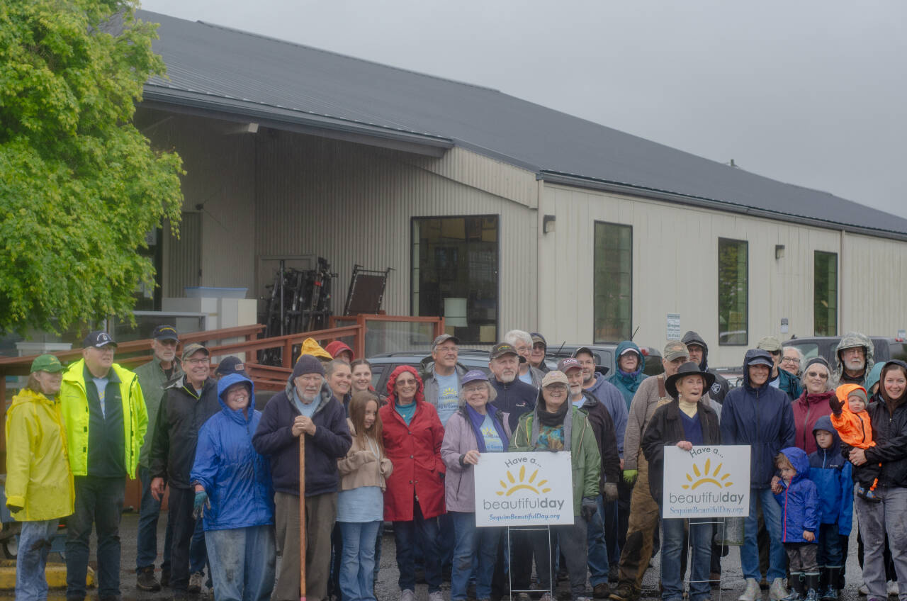 Sequim Gazette photo by Elijah Sussman / Sequim Beautiful Day volunteers take a break from their efforts at Serenity House on April 27.