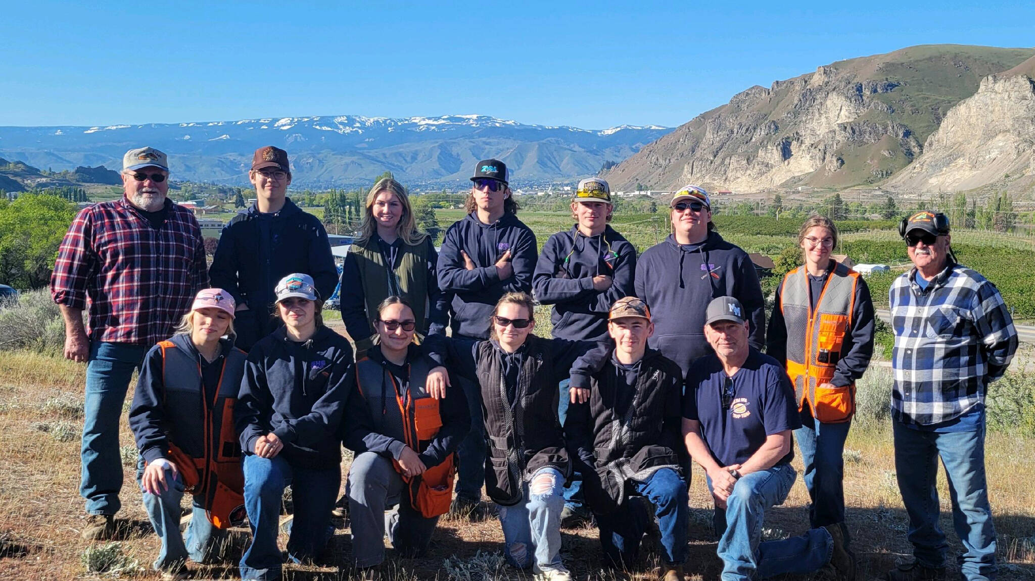 Photo courtesy of Bill McFarlen / Sequim High FFA students and advisors enjoy a successful FFA trap shooting competition in Wenatchee in April. Pictured are (back row, from left) Kevin Woods, Cole Tate, Lillian Bond, Austin Parker, Westin Opdyke, Zak Bell, Aurora Cline and Charles Rusciano, with (front row, from left) Susannah Sharp, Lily Meyer, Elizabeth Howard, Elizabeth Beebe, Levi Breithaupt and Bill McFarlen.