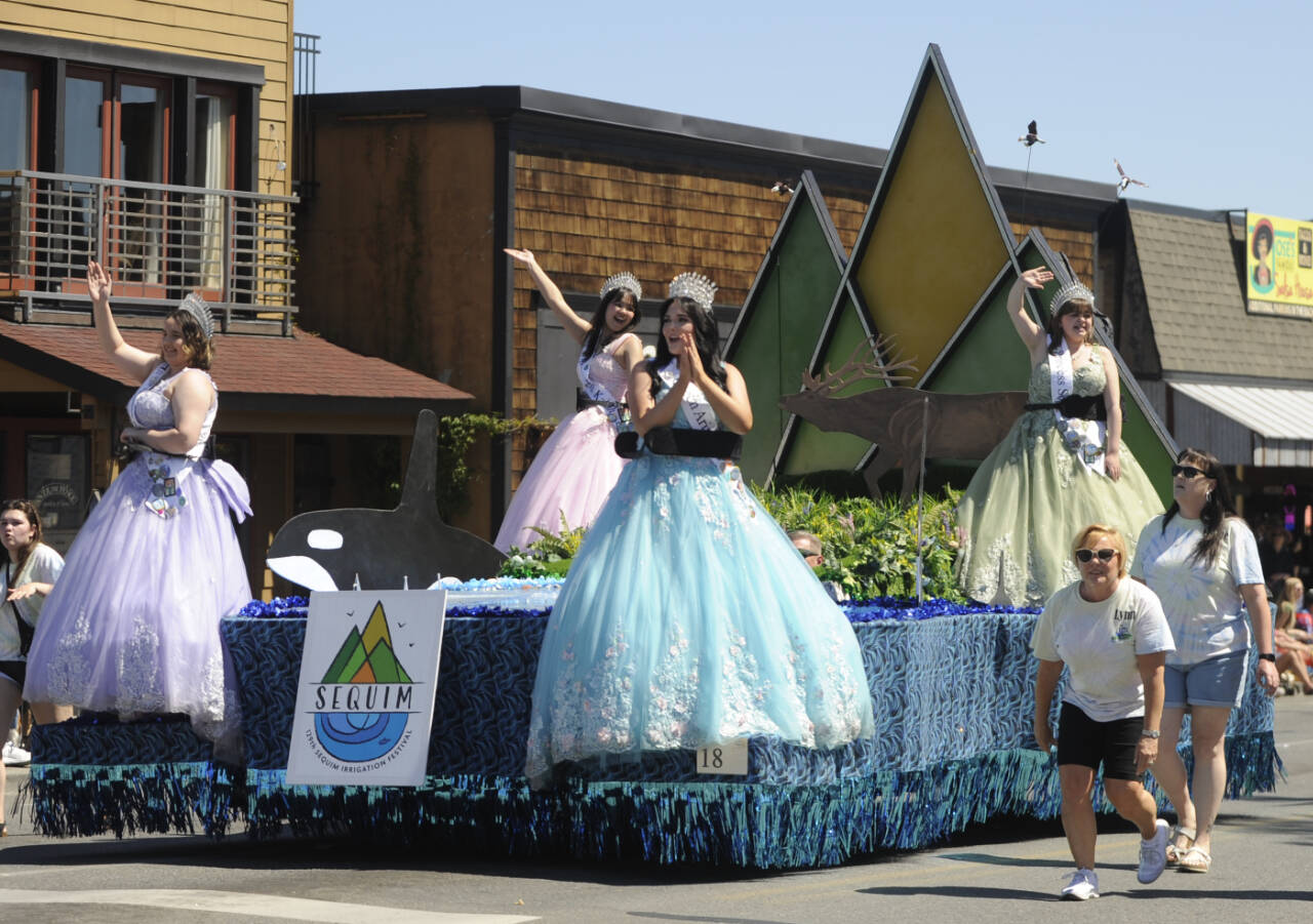 Sequim Gazette photo by Michael Dashiell / Sequim Irrigation Festival Royalty (from left) princesses Ashlynn Northaven and Kailah Blake, queen Ariya Goettling and princess Sophia Treece wave to the Grand Parade crowd on Saturday.