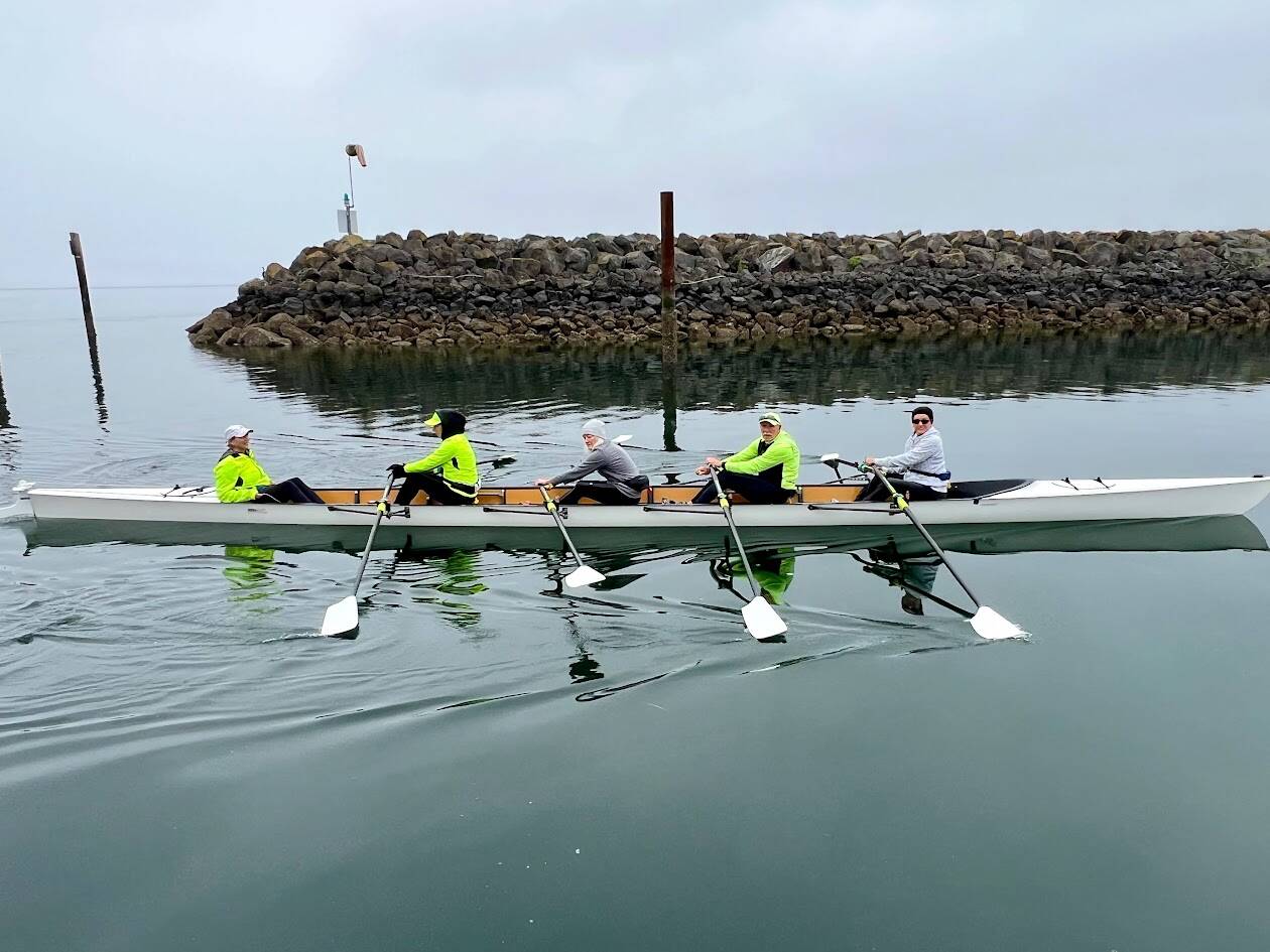 Photo by Doug Schwarz photo for Sequim Bay Yacht Club
Sequim Bay Yacht Club rowing co-captain Jeanne Neal, far left, coxed the club’s training shell when prospective rowers tried out sculling during the May 5 Opening Day of Boating Season.