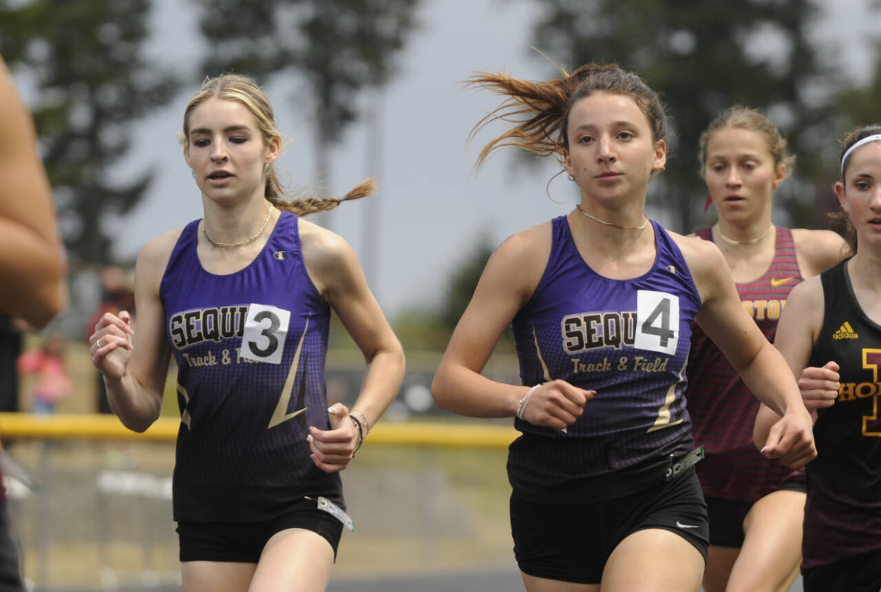 Sequim Gazette photo by Michael Dashiell
Sequim’s Dawn Hulstedt, left, and Kaitlyn Bloomenrader race to state berths in the 800-meter race at the West Central Bi-district meet in Belfair on May 18. Bloomenrader placed second in the heat and third overall while Hulstedt placed third in the heat and fourth overall.
