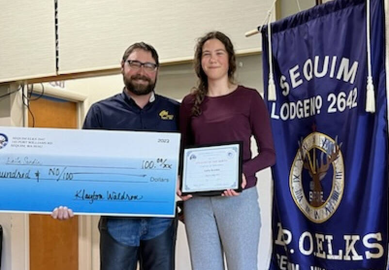 Photo courtesy of Sequim Elks / Laila Sundin accepts her Sequim Elks Student of the Month award for May 2024 from Sequim Elks Exalted Ruler Klayton Waldron.